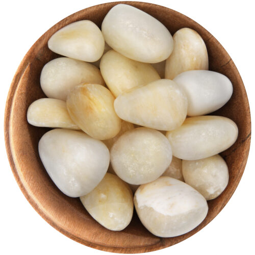 Bowl of tumbled Barite. Rounded shapes, perfectly smooth, with a white-yellow color and a subtle white shimmer.