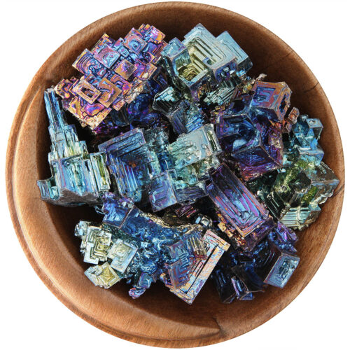 Bowl of Bismuth hopper crystals. Irregular geometric shapes with bright multi-colored metallic hues