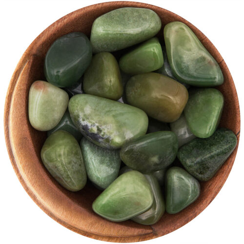 Bowl of tumbled green Grossular Garnets. Irregular shapes, polished smooth, in a rich green shade.