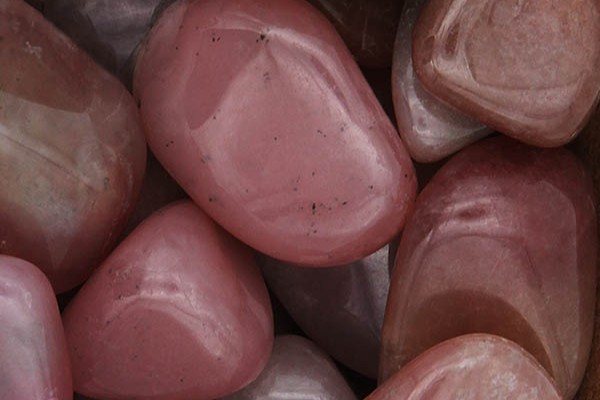 Close up of tumbled Pink Grossular Garnet