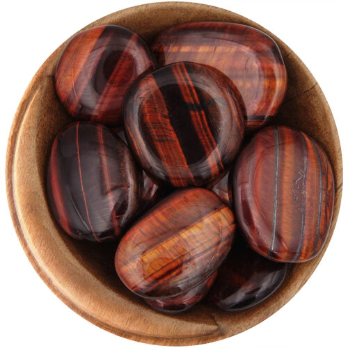 Bowl of polished Red Tigers Eye palm stones. Large oval stones with flashing red and dark red stripes.